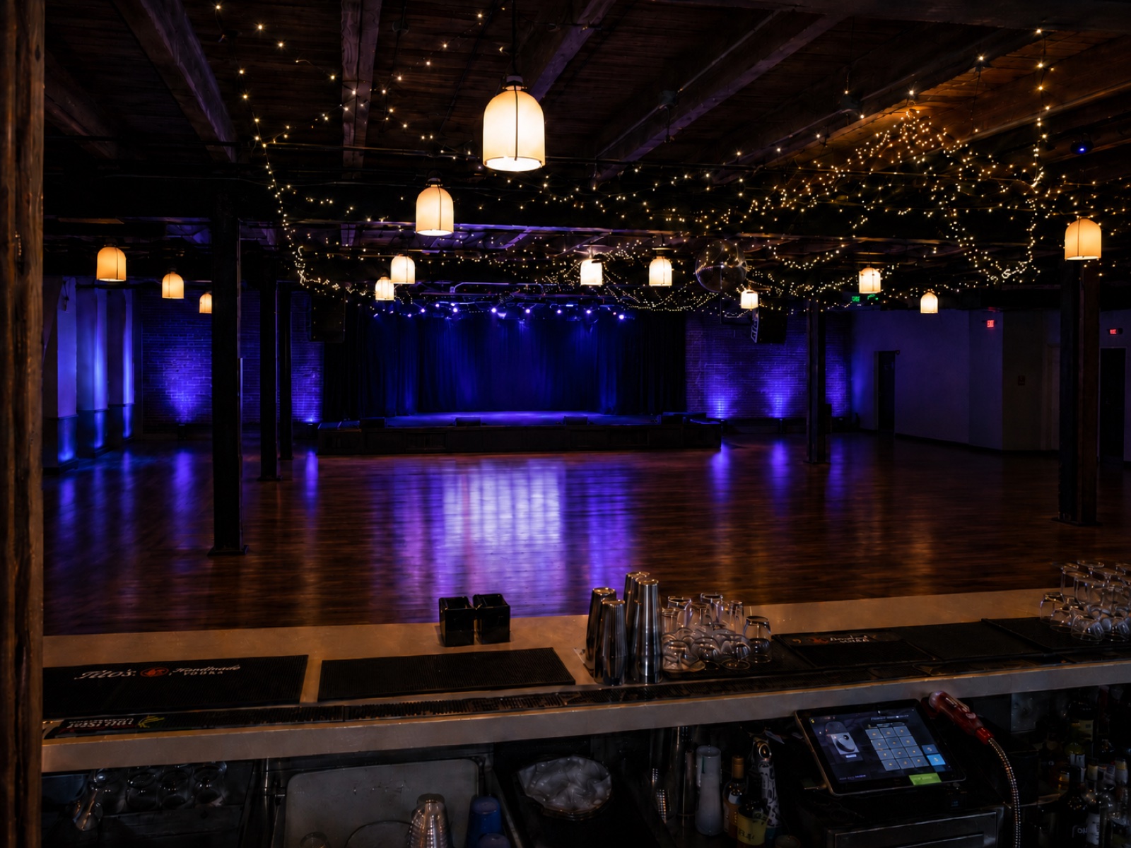 The Social — empty room with string lights
